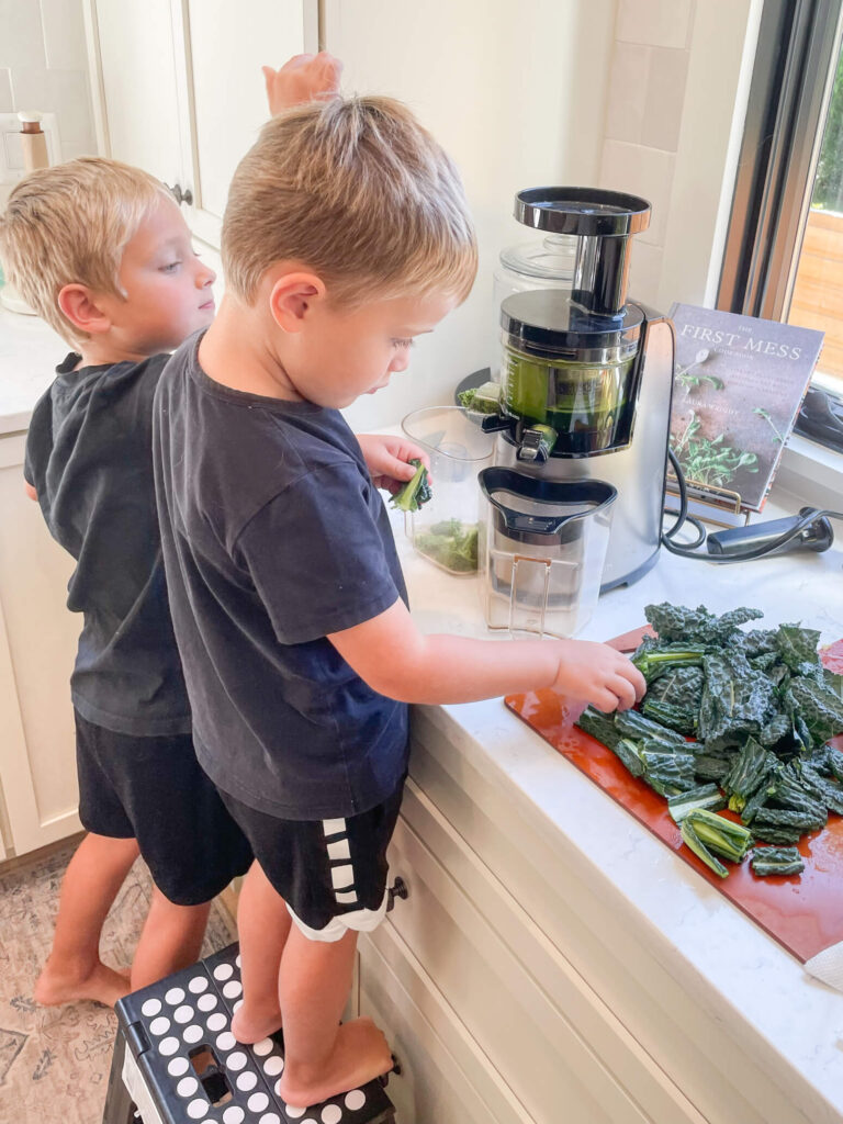 children helping prepare veggies to eat